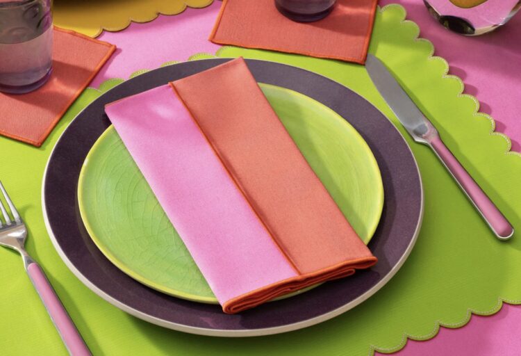 Lollipop Reclaimed Two-Tone Napkin on a place setting with a lime green placemat